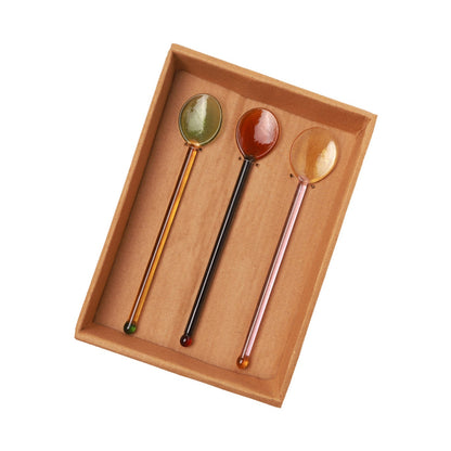 Daisy Glass Stirring Spoon, glass stirring spoons laid in a tray