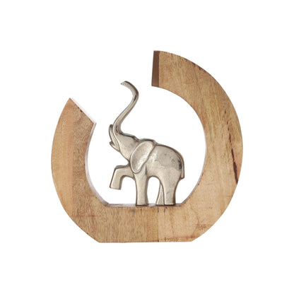 Ivy Elephant Figurine, A polished silver elephant figure with its trunk raised, set inside a crescent-shaped natural wood frame.