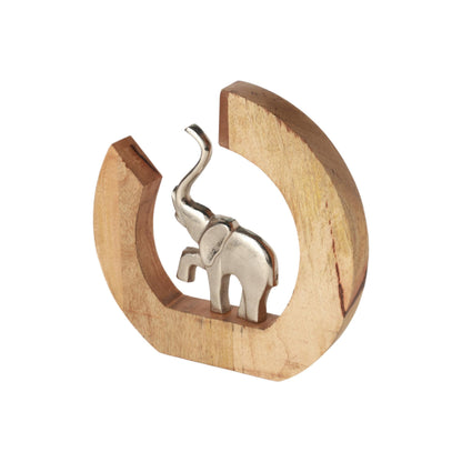 Ivy Elephant Figurine, A polished silver elephant figure with its trunk raised, set inside a crescent-shaped natural wood frame.