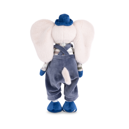 Tusk Plush Elephant, A cream plush elephant with wide ears in slate-blue corduroy dungarees with stitched patches, a striped jumper, a cobalt hat, mittens and shoes.