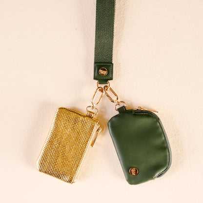 Dynamic Duo Pouch Luxe Wristlet in Evergreen Gold, An evergreen zip pouch and a gold woven zip pouch clipped together on a wide evergreen wrist strap.