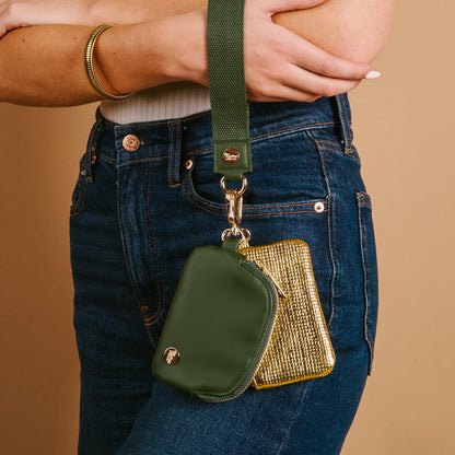 Dynamic Duo Pouch Luxe Wristlet in Evergreen Gold, An evergreen zip pouch and a gold woven zip pouch clipped together on a wide evergreen wrist strap.