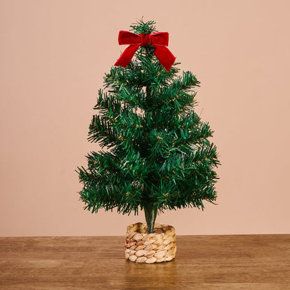 Green Mini Artificial Christmas Tree, A small artificial Christmas tree with full green branches, a red velvet bow at the top, and a woven basket base.