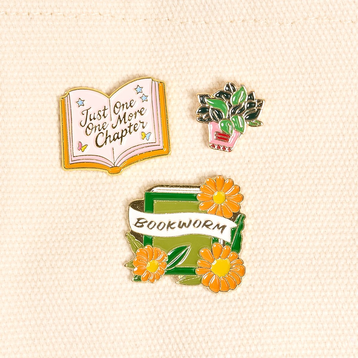 Enamel Pin Pack, A boxed set of three gold enamel pins in the Latte Love design, a coffee cup, a teddy bear, and a pink bow.