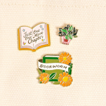 Enamel Pin Pack, A boxed set of three gold enamel pins in the Latte Love design, a coffee cup, a teddy bear, and a pink bow.