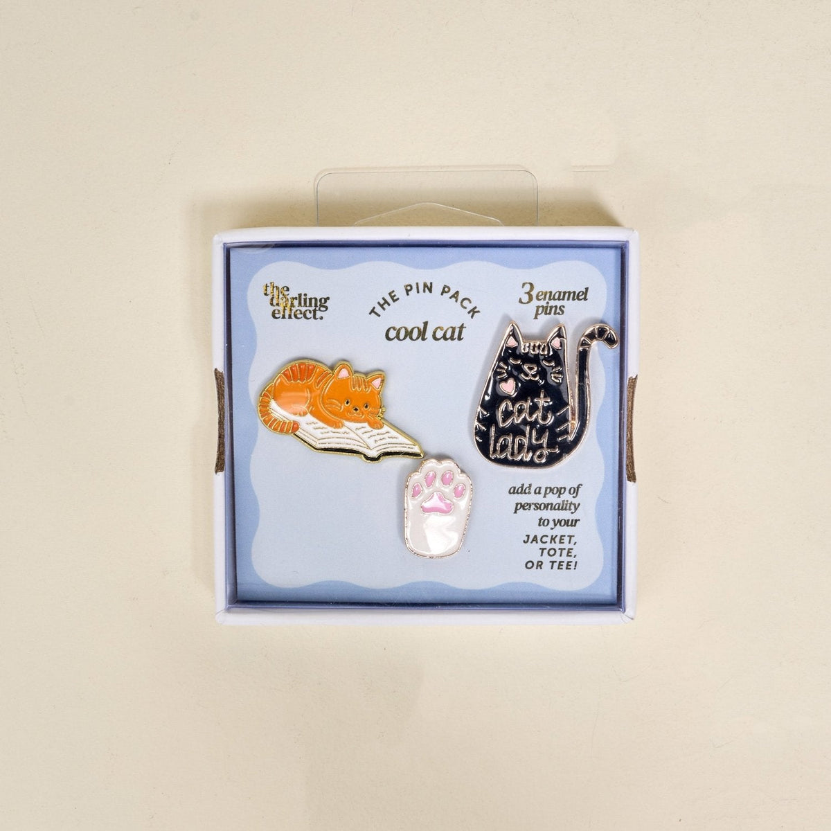 Enamel Pin Pack, A boxed set of three gold enamel pins in the Latte Love design, a coffee cup, a teddy bear, and a pink bow.