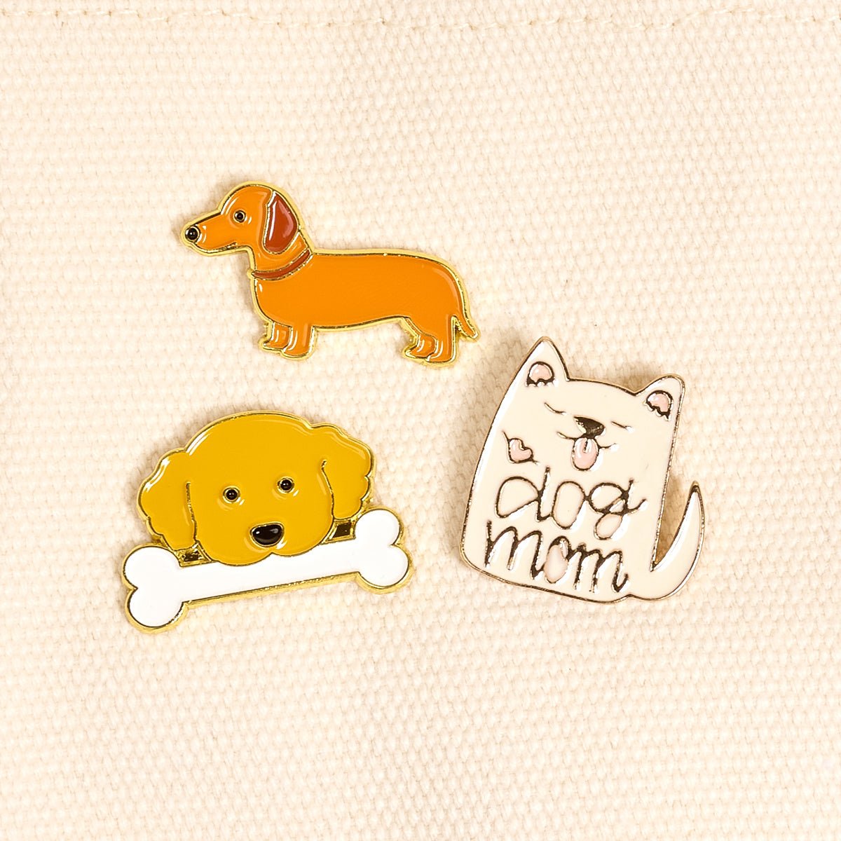 Enamel Pin Pack, A boxed set of three gold enamel pins in the Latte Love design, a coffee cup, a teddy bear, and a pink bow.