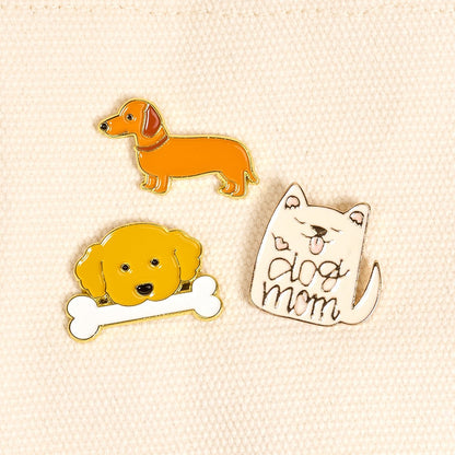 Enamel Pin Pack, A boxed set of three gold enamel pins in the Latte Love design, a coffee cup, a teddy bear, and a pink bow.