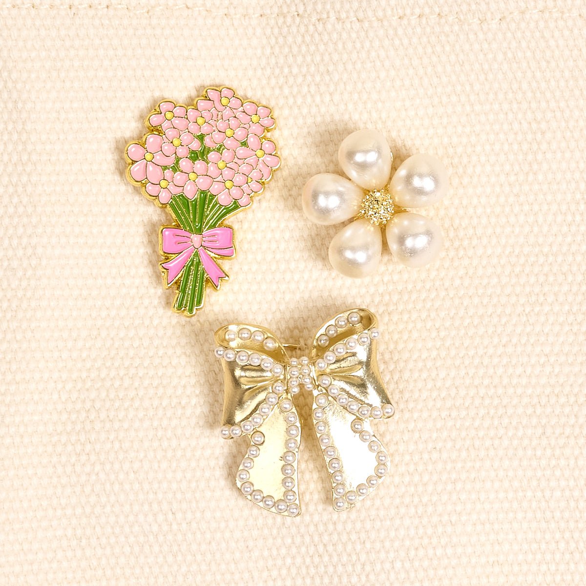 Enamel Pin Pack, A boxed set of three gold enamel pins in the Latte Love design, a coffee cup, a teddy bear, and a pink bow.