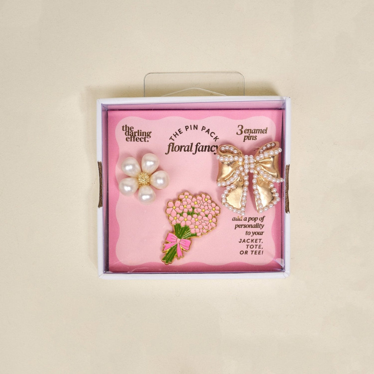 Enamel Pin Pack, A boxed set of three gold enamel pins in the Latte Love design, a coffee cup, a teddy bear, and a pink bow.