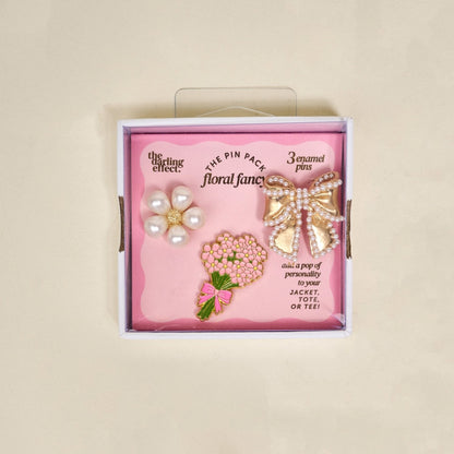 Enamel Pin Pack, A boxed set of three gold enamel pins in the Latte Love design, a coffee cup, a teddy bear, and a pink bow.