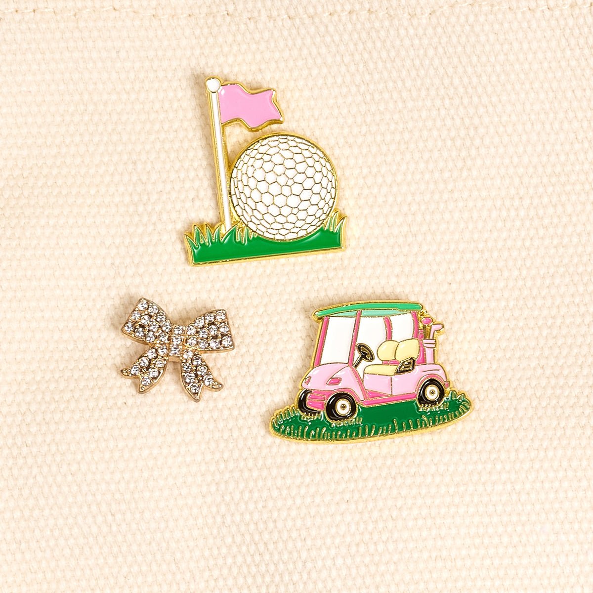 Enamel Pin Pack, A boxed set of three gold enamel pins in the Latte Love design, a coffee cup, a teddy bear, and a pink bow.