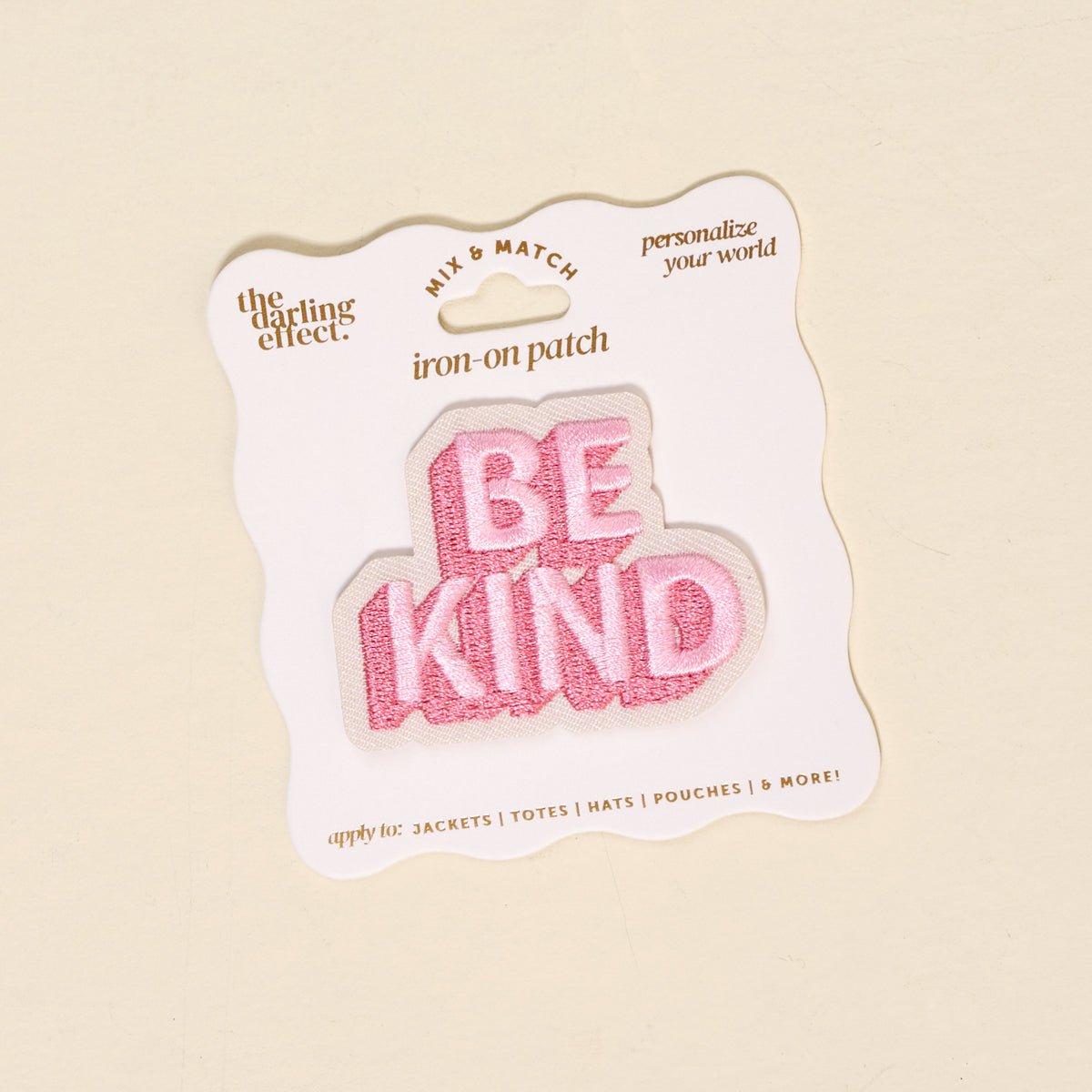 Mix & Match Iron-On Patch, A pink Be Kind patch on its patch card, with BE KIND spelled out in bold pink lettering.