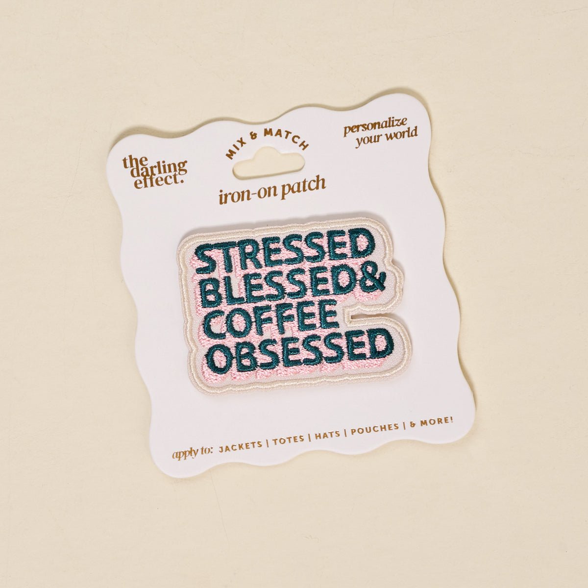 Mix & Match Iron-On Patch, A pink Be Kind patch on its patch card, with BE KIND spelled out in bold pink lettering.