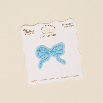Mix & Match Iron-On Patch, A pink Be Kind patch on its patch card, with BE KIND spelled out in bold pink lettering.
