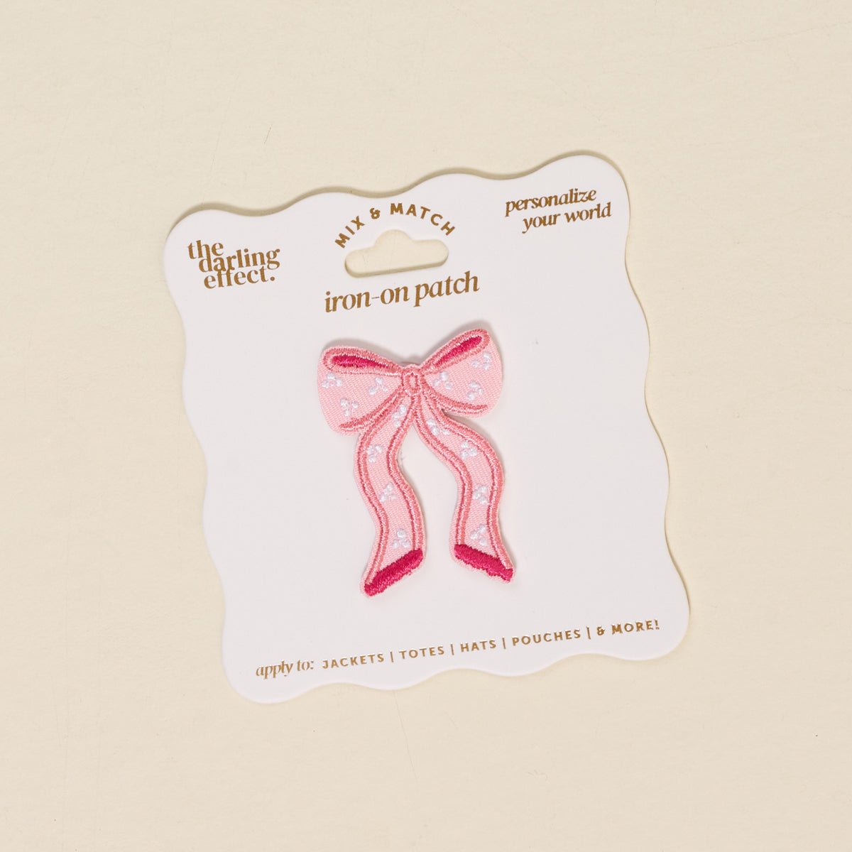 Mix & Match Iron-On Patch, A pink Be Kind patch on its patch card, with BE KIND spelled out in bold pink lettering.
