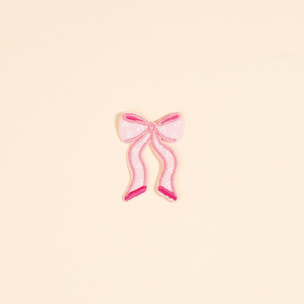 Mix & Match Iron-On Patch, A pink Be Kind patch on its patch card, with BE KIND spelled out in bold pink lettering.