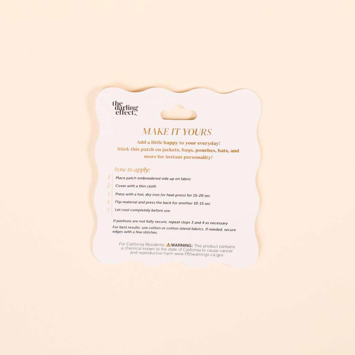 Mix & Match Iron-On Patch, A pink Be Kind patch on its patch card, with BE KIND spelled out in bold pink lettering.