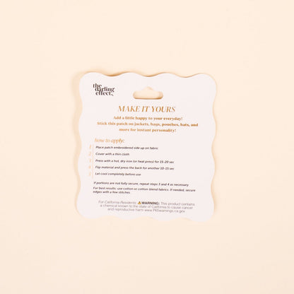 Mix & Match Iron-On Patch, A pink Be Kind patch on its patch card, with BE KIND spelled out in bold pink lettering.