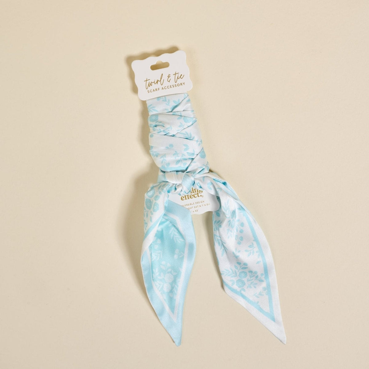 Twirl & Tie Scarf Accessory, A red and white gingham satin scarf tied in a knot, showing a red polka dot pattern on the reverse side of the tails.