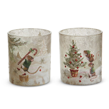A Very Mouse Christmas Glass Container, Two frosted glass containers side by side, one printed with a mouse carrying a candy cane on a gift box and one with two mice decorating a small potted Christmas tree.