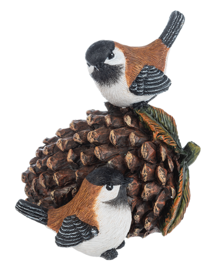 Acorn and Pinecone Bird Figurine, Two figurines, each with a pair of black-capped birds with rust-colored backs perched on an acorn and pinecone or on a large pinecone with autumn leaves.