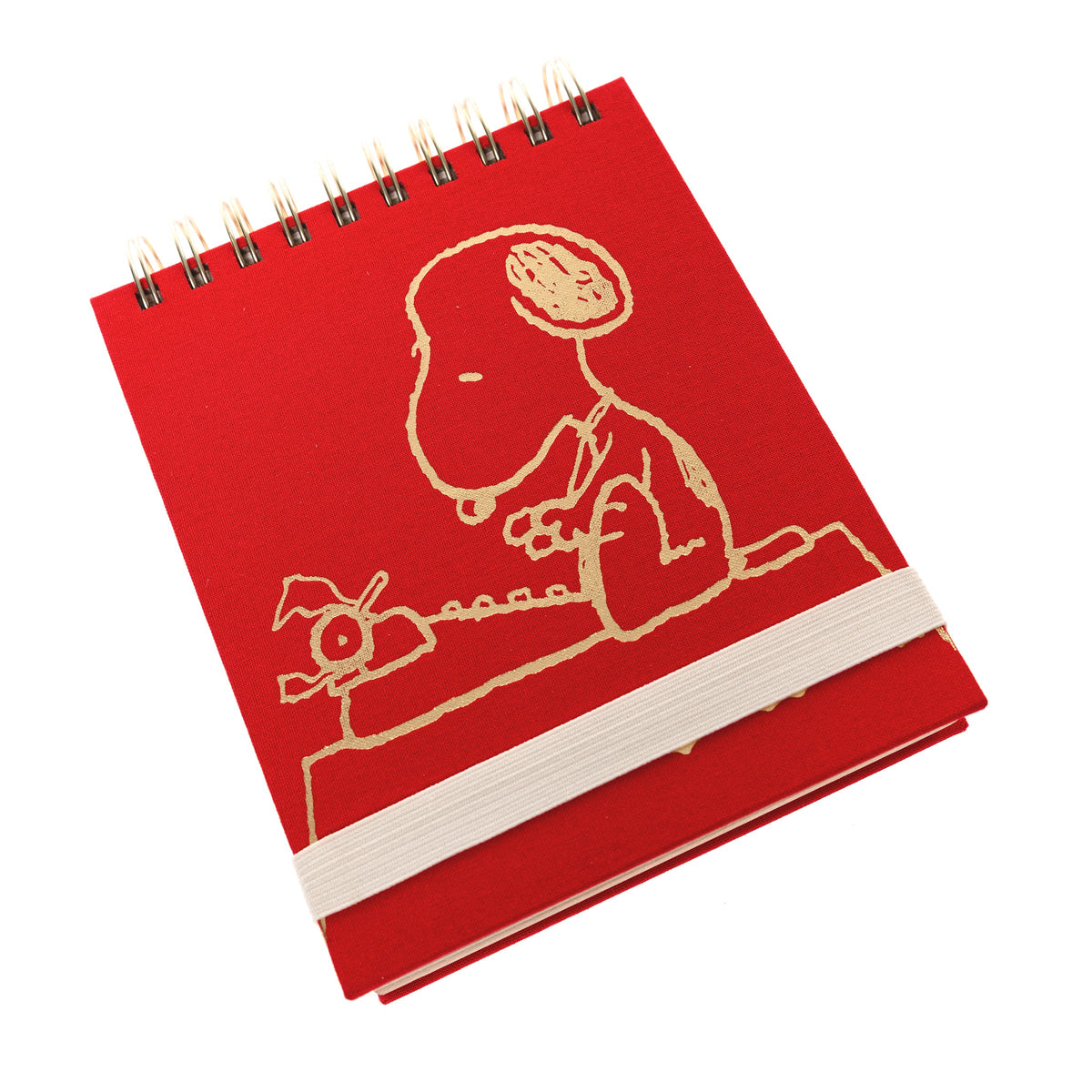 Peanuts Fabric-Bound Notepad, A red fabric-bound notepad with Snoopy typing at his typewriter in gold foil on the cover and gold gilded page edges.