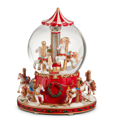 Animated Musical Carousel Water Globe, A resin and glass water globe with a carousel scene of horses inside, set on a red base with more carousel horses and a wreath.