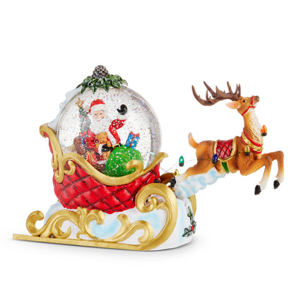 Animated Santa's Sleigh and Reindeer Lighted Water Globe, Santa with a sack of toys in a glowing water globe that rides in a red quilted sleigh on gold scrolled runners, with a reindeer in mid-leap on a cloud ahead of it.