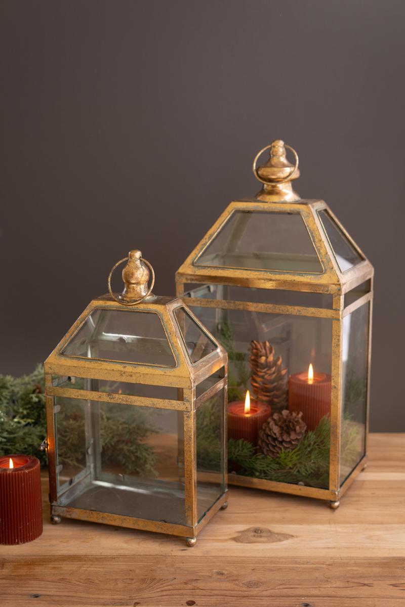 Antique Gold Christmas Lantern, Two antique gold metal lanterns with glass panels, one large and one small.