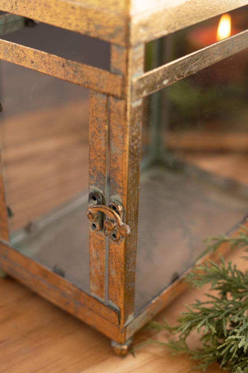 Antique Gold Christmas Lantern, Two antique gold metal lanterns with glass panels, one large and one small.