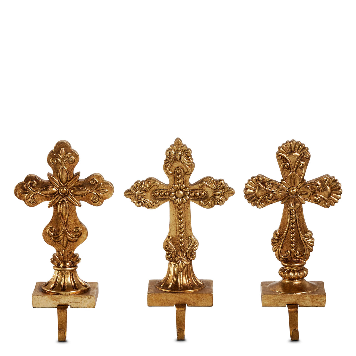 Antique Gold Holy Cross Stocking Holder, Three antique gold cross stocking holders side by side, each on a rectangular base with a hook, showing the rounded, beaded and shell cross designs.