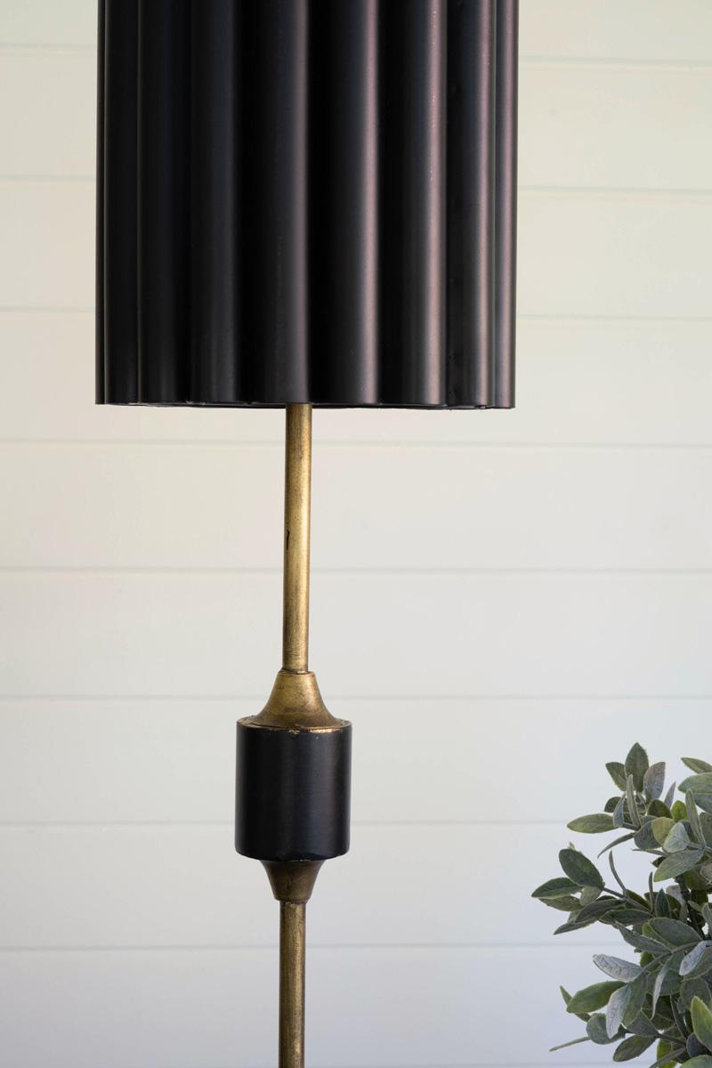 Antique Gold Table Lamp with Fluted Black Metal Shade, A tall antique gold table lamp with a fluted black metal shade.