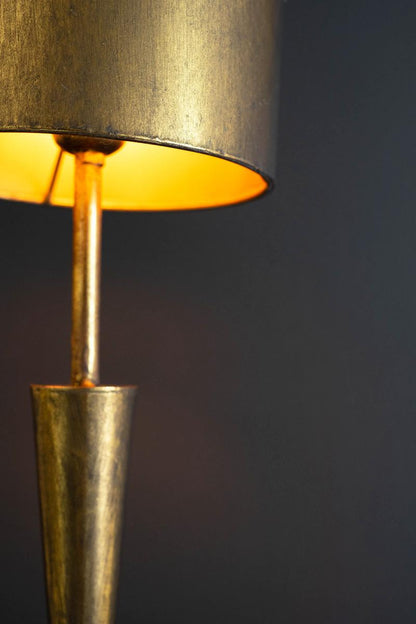 Antique Gold Table Lamp with Metal Barrel Shades, A tall antique gold table lamp with a conical metal shade.