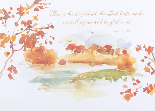 Autumnal Watercolor Landscape Greeting Card, A landscape-format card front with a watercolor lake scene, autumn trees and red-orange leaves, and the gold script verse of Psalm 118:24 across the top.