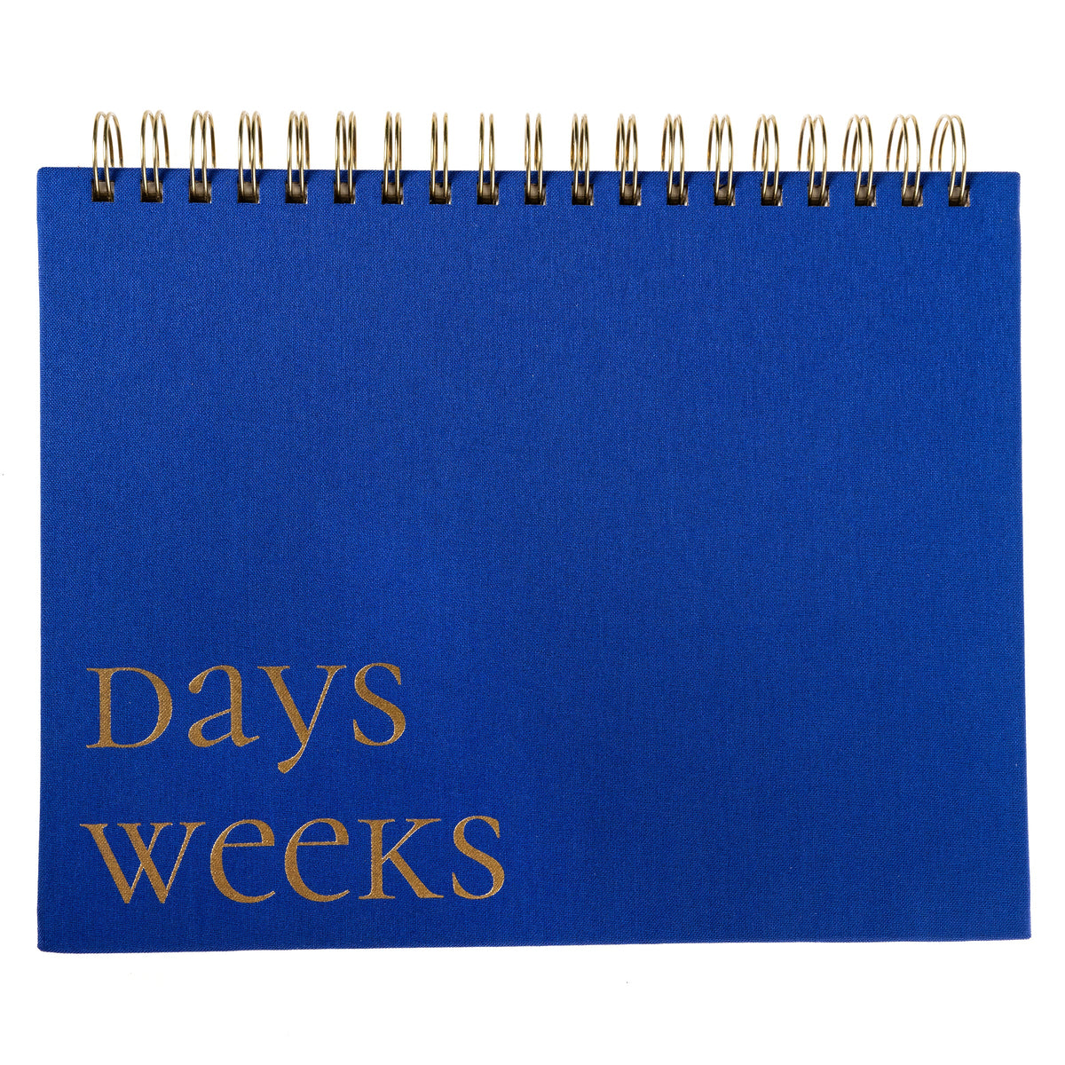 Cobalt Blue Fabric-Bound Weekly Desk Pad, A cobalt blue fabric desk pad reading days weeks in gold foil with a spiral top binding.