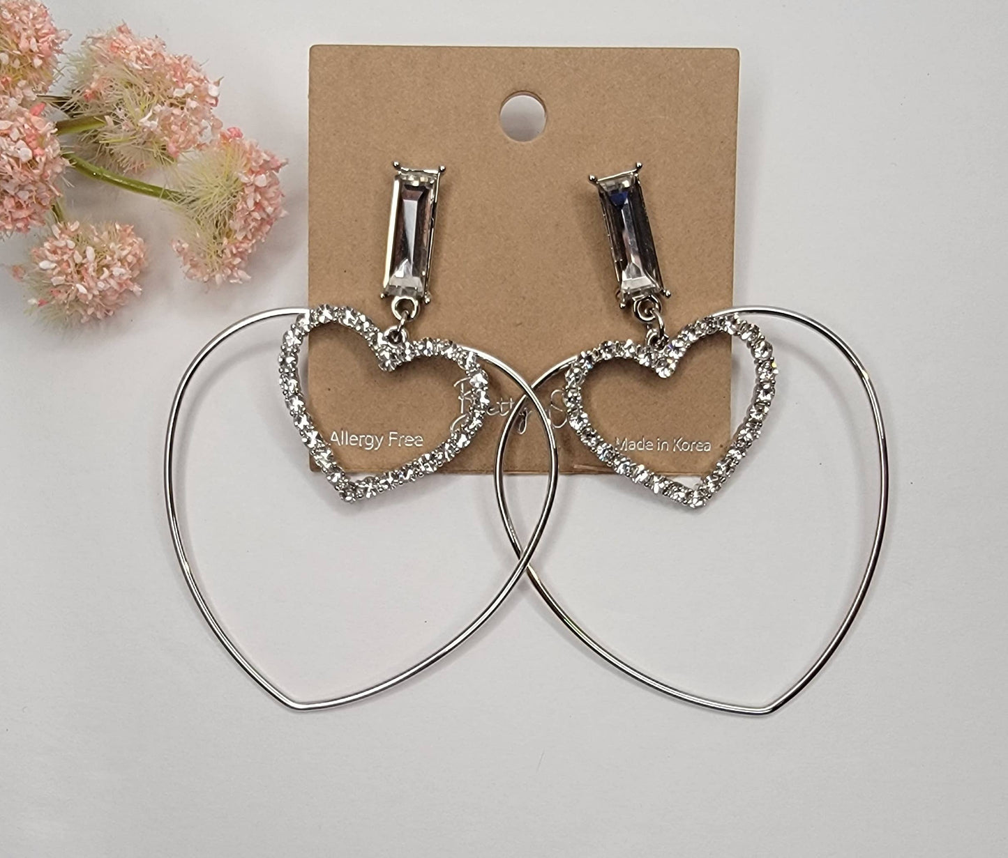 DOUBLE HEART DANGLE EARRINGS.