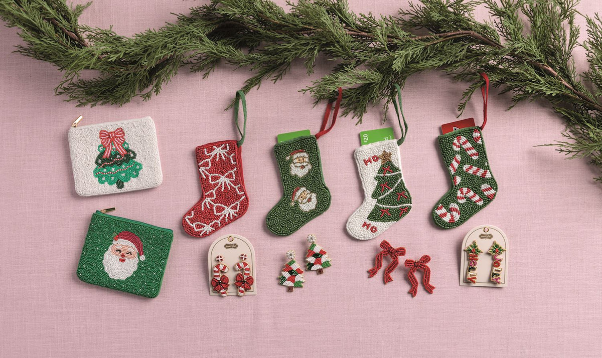 Beaded Holiday Statement Earrings, Four pairs of beaded Christmas earrings on cream cards: trees, Holly Jolly letters, red bows and candy canes.