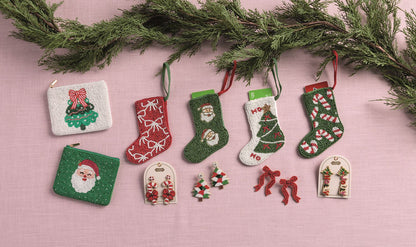 Beaded Holiday Statement Earrings, Four pairs of beaded Christmas earrings on cream cards: trees, Holly Jolly letters, red bows and candy canes.