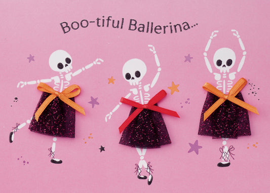 Boo-tiful Ballerina Greeting Card, Front of the card showing three skeleton ballerinas in glittery black skirts with orange and red ribbon bows on a pink ground, with the words Boo-tiful Ballerina arched above them.