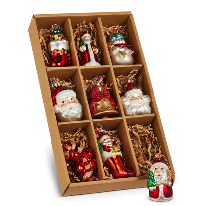 Box of Christmas Ornaments, A cardboard box with nine compartments holding glass Christmas ornaments shaped like Santas, a snowman, a bow and a bell in red, gold, white and green.