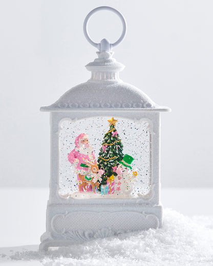 Bubblegum Blowin' Friends Lighted Water Lantern, A white glittered lantern-shaped water globe with a lit scene of Santa, a deer, and a snowman blowing bubblegum around a Christmas tree.