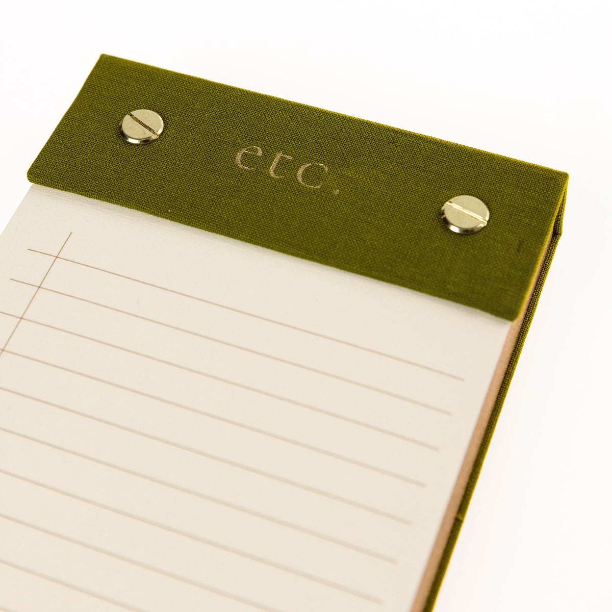 Olive Fabric-Bound Desktop Notepad, An olive green fabric desktop notepad with etc lettered in gold foil and two gold posts at the top.