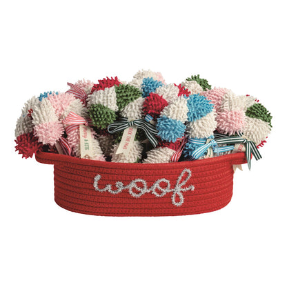 Candy Cane Plush Dog Toy, Four shaggy plush candy cane dog toys in red, pink, green and blue stripes, each tied with a ribbon and tag.
