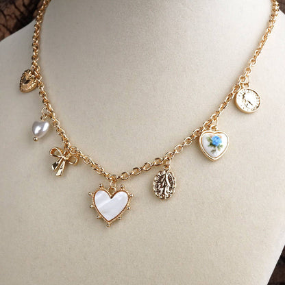 Multi-Charm Heart Necklace in Gold Tone