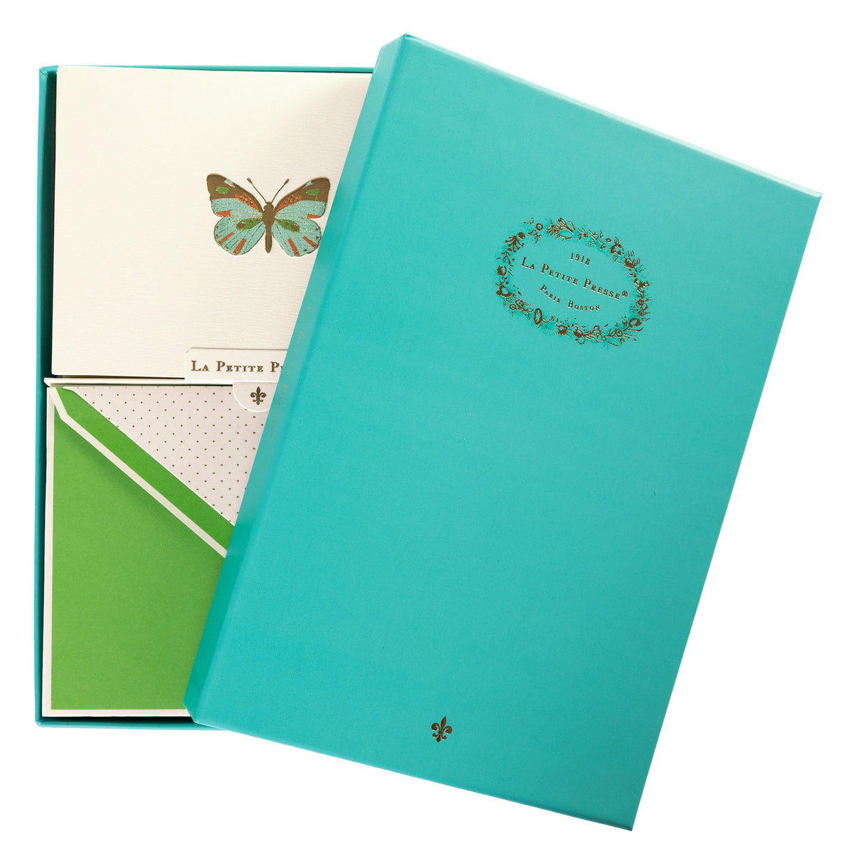 La Petite Presse Butterfly Boxed Correspondence Notes, A cream notecard with a colorful teal, orange, and brown foil butterfly, paired with a bright green lined envelope in an open teal gift box.