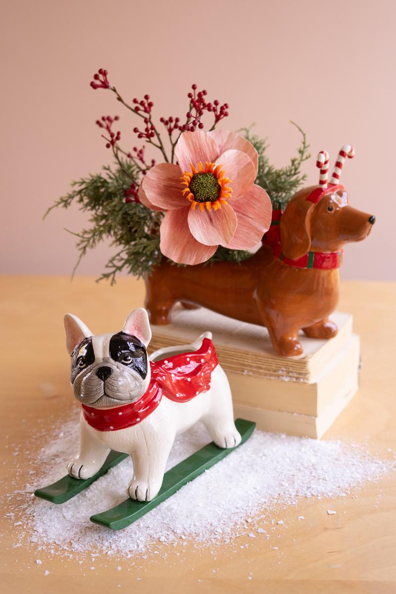 Ceramic Christmas Skiing Dog Planter, A glossy ceramic dog figure on skis with a planter opening in its back.