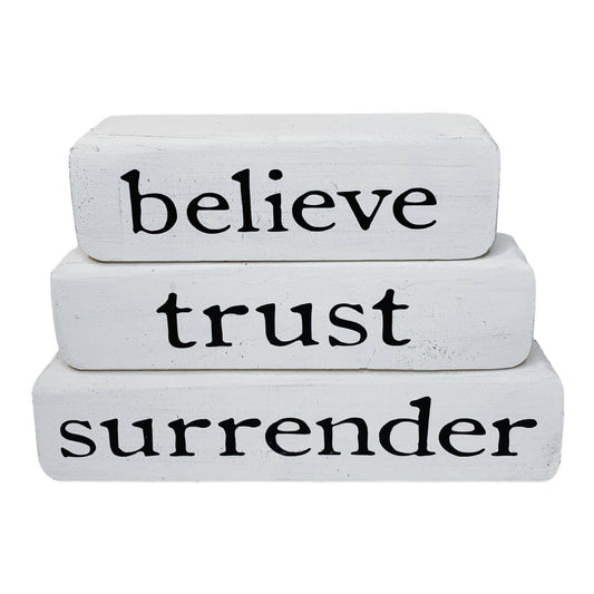 Believe Trust Surrender – Brown Stacked Blocks