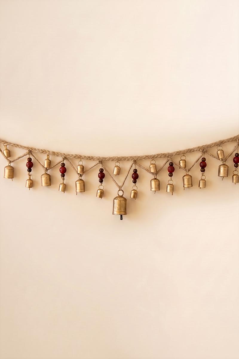Christmas Bell Garland with Wood Beads, A garland of hanging metal bells strung with wood beads on jute cord.