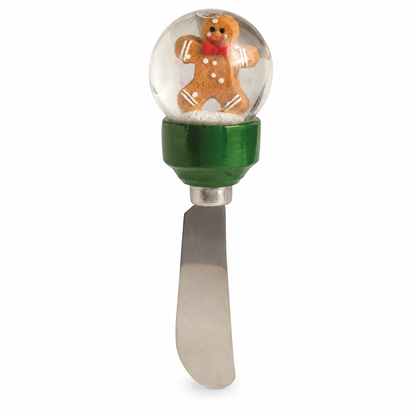 Christmas Snow Globe Cheese Spreader, Gingerbread Man design: a gingerbread cookie on a green base, and a snowy tree on red
